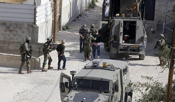 الاحتلال يعتقل مواطنا ومستعمرون يعتدون ع...