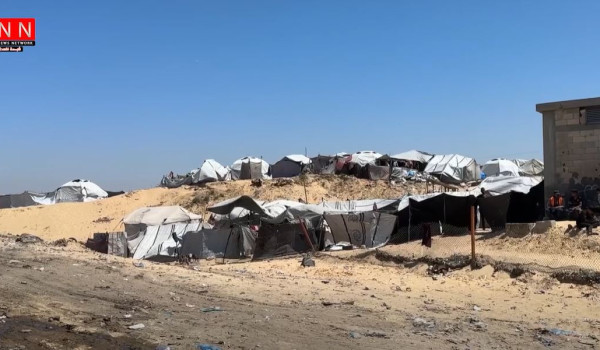 Between Tents and a Garbage Dump, Displa...